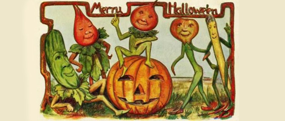 A vintage postcard of pumpkin-headed sprites dancing around a jack o'lantern